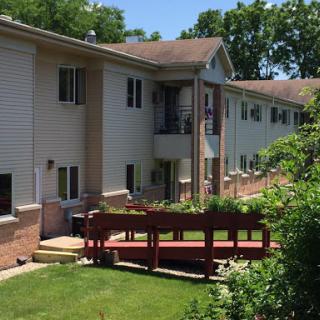 A sunny day at a residential apartment complex featuring a well-maintained outdoor space.