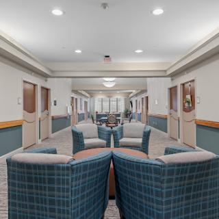 A spacious and welcoming waiting area featuring comfortable seating arrangements and bright lighting.