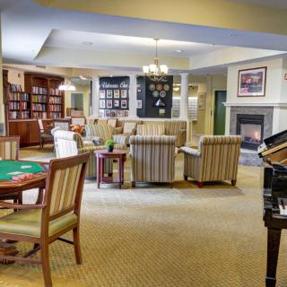 Cozy lounge area with a library and fireplace.
