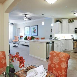 A modern open-concept kitchen and living room with a dining area.