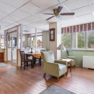 A bright and airy waiting area with comfortable seating and large windows.