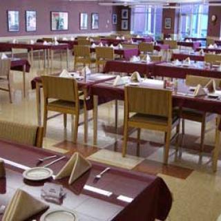 A spacious restaurant dining area set for a meal.