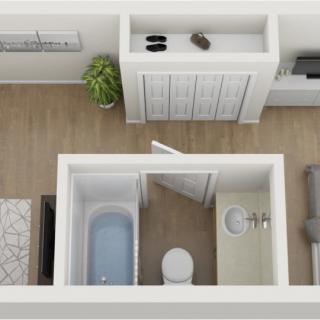 Top view of a minimalist bathroom layout with a bathtub, toilet, and sink.