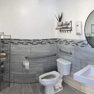 A modern and stylish bathroom featuring essential amenities and accessibility features.
