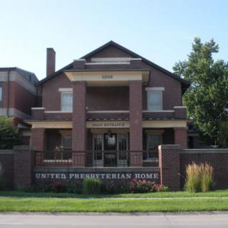A brick residential building marked as the United Presbyterian Home.
