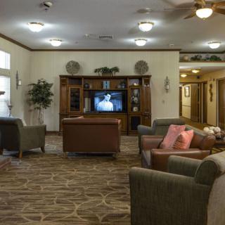 A cozy living room with comfortable seating and a television.