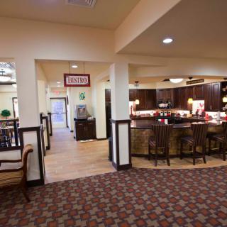 A welcoming lobby with a reception desk and seating area.