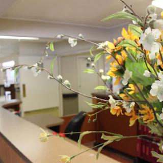 A welcoming reception area adorned with decorative flowers.