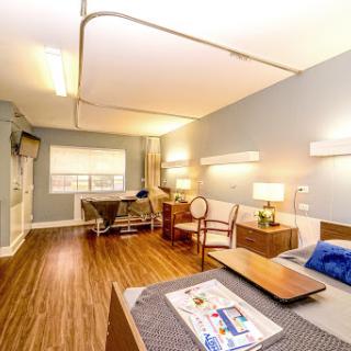 A well-equipped and modern hospital room designed for patient comfort.