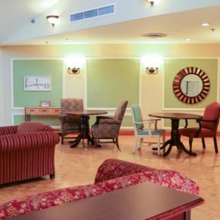 A cozy lounge area with comfortable seating and warm lighting.