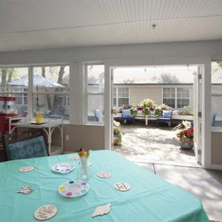 A bright and inviting dining area with a view of a lovely outdoor space.