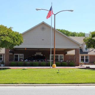Front view of a community building with an American flag.