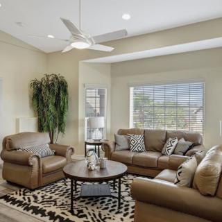 A cozy living room with comfortable sofas, a central coffee table, and stylish decor.