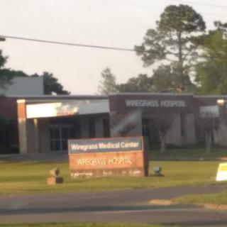 A view of a hospital building with signage for a medical center.
