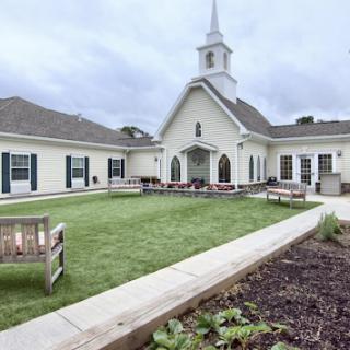 A serene church setting with well-maintained grounds, perfect for community gatherings.