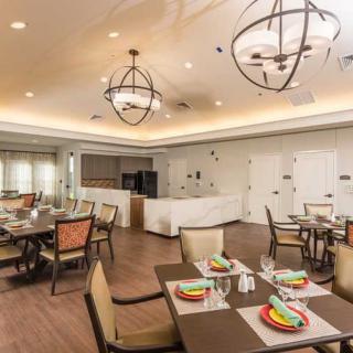 A modern dining room with elegantly set tables and stylish lighting.
