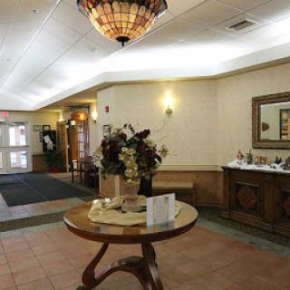 A welcoming hotel lobby featuring elegant decor and a spacious layout.