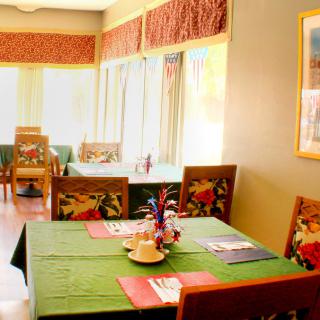 A cozy restaurant interior with tables set for dining.