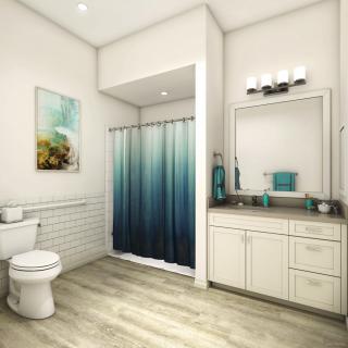 A modern bathroom with sleek furnishings and a gradient shower curtain.