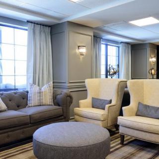 A cozy living room with stylish seating and natural light.