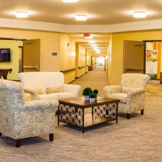 A cozy lobby area with comfortable seating and warm lighting.