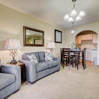 A cozy living and dining area with modern furniture and decor.