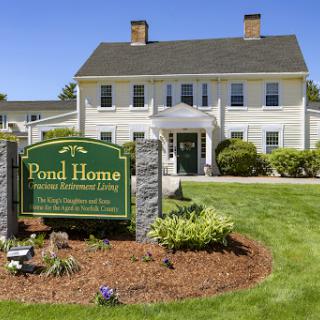 Pond Home, a scenic residential care facility with well-maintained landscaping.