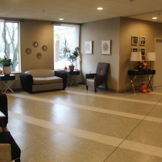 A cozy lobby area featuring comfortable seating and decorative elements.