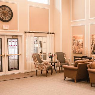 A cozy and elegant lounge area featuring comfortable seating and tasteful decor.