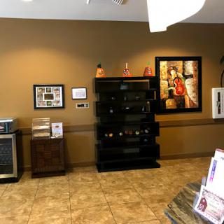 A welcoming reception area featuring modern decor and a selection of beverages.
