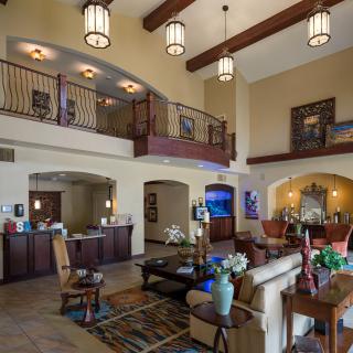 A spacious hotel lobby with comfortable seating and elegant decor.