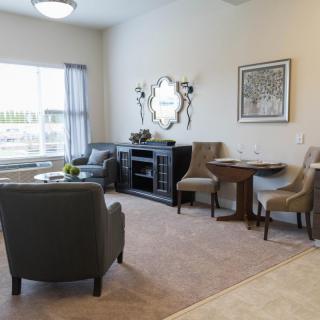A well-decorated living room with comfortable seating and stylish decor.