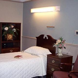 Cozy room with a bed and decorative elements.