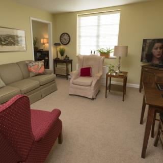 A cozy living room with comfortable seating and a television.
