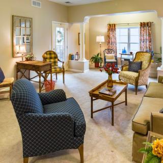 A cozy living room with stylish furniture and warm lighting.