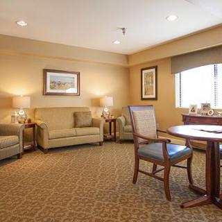 A cozy living room with comfortable seating and natural lighting.