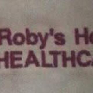 A partial view of a healthcare-related sign or logo.