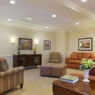 A cozy living room with comfortable seating and elegant decor.