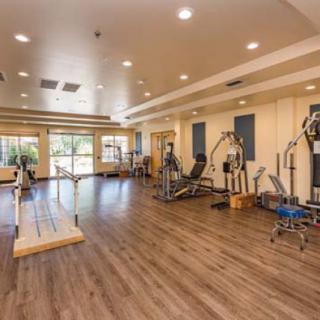A spacious gym with a variety of exercise equipment.