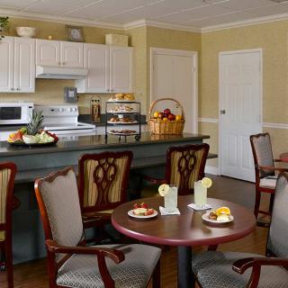 A cozy kitchen and dining area with elegant furniture and decor.