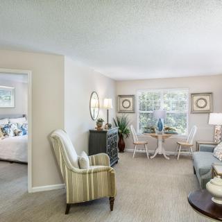 A cozy living room with elegant furniture and decor.