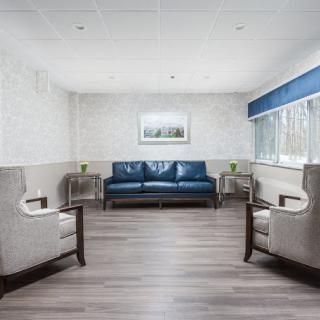 A modern waiting room with comfortable seating and natural light.