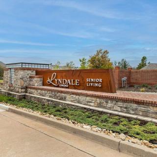 Entrance sign to the Lindale community, showcasing landscaped surroundings.