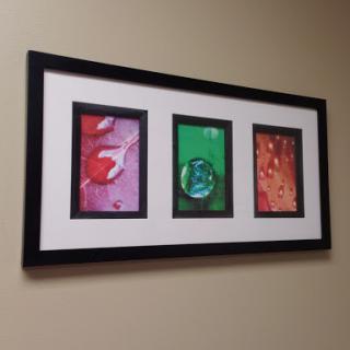 A contemporary framed triptych featuring vibrant abstract designs.