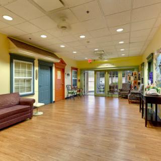 A spacious lobby area with comfortable seating and warm decor.