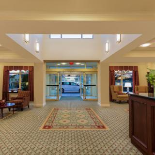A welcoming hotel lobby featuring comfortable seating and elegant decor.