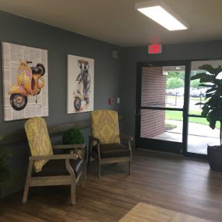 A cozy lobby space with artistic decor and comfortable seating.