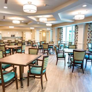 A spacious dining area with modern decor and ample seating.