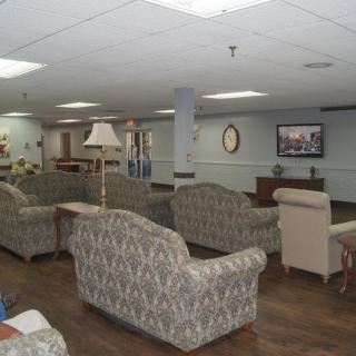 A cozy lounge area with sofas and a television.