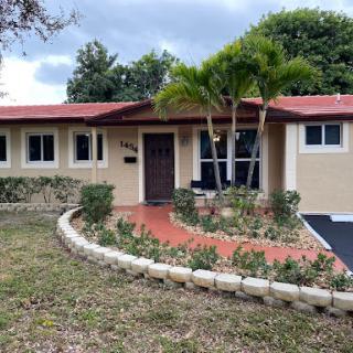 A charming residential house with a beautifully landscaped garden.